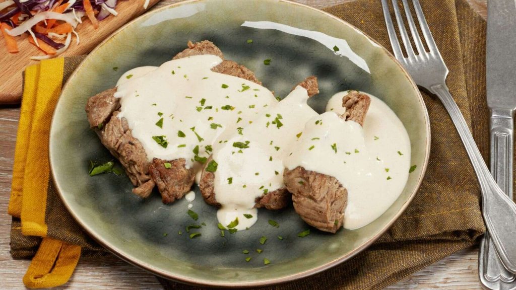 White Sauce spread on meat