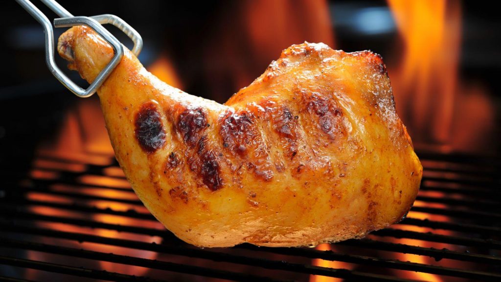 Chicken drumstick on grill