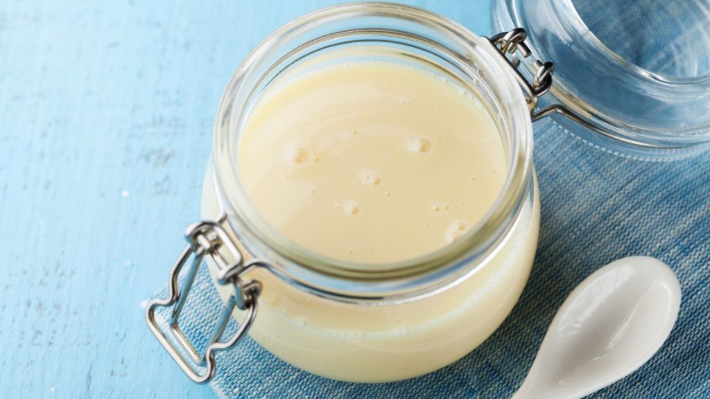 Evaporated milk in a glass container