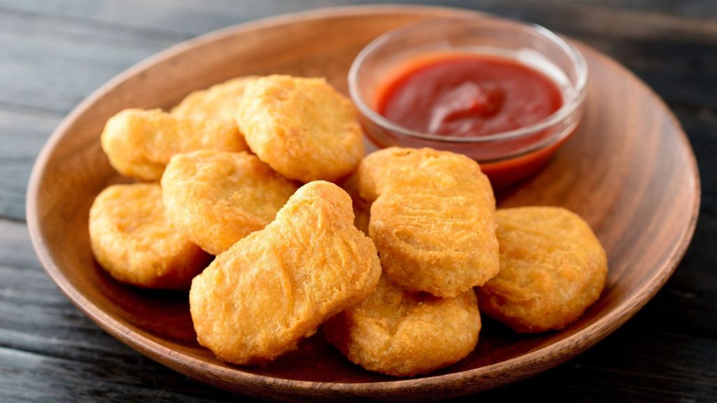 Chicken nuggets with ketchup in a plate