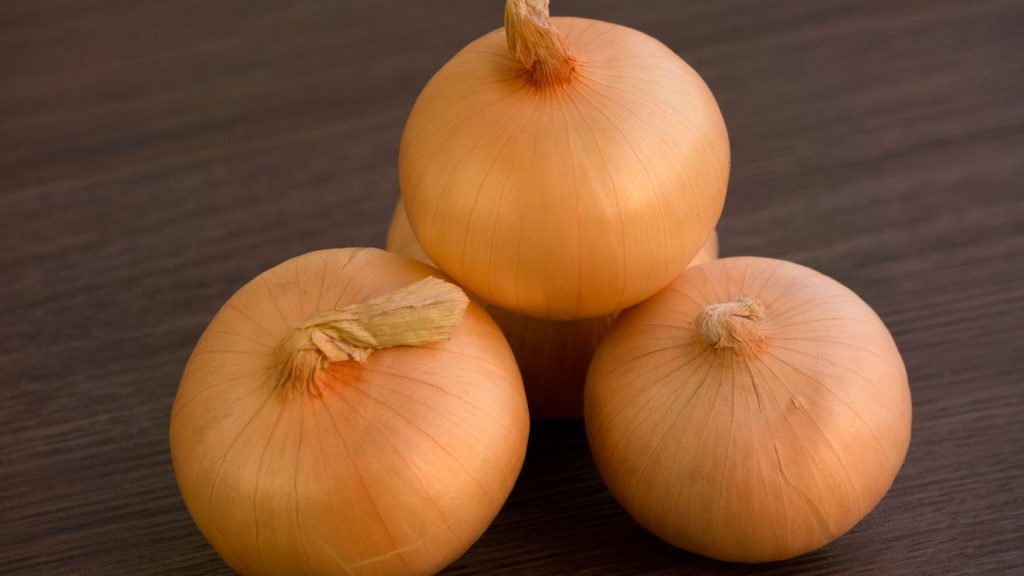 Yellow onions on a table